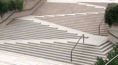 Innovative outdoor staircase showing a mix of ramps, steps, and railed areas